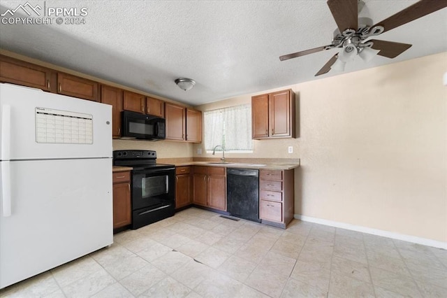 kitchen with a textured ceiling, sink, ceiling fan, and black appliances