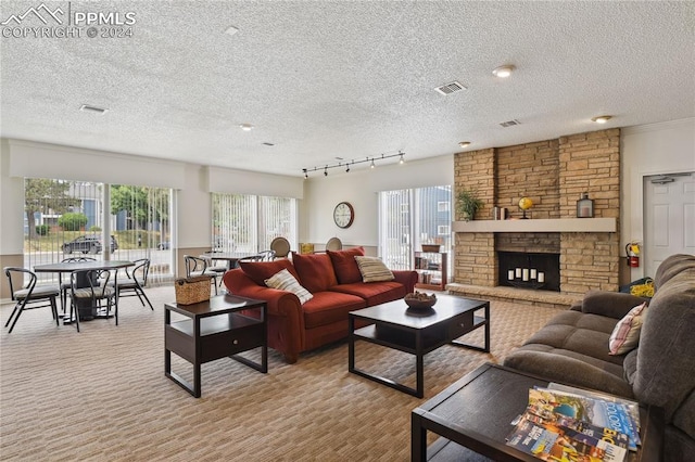 living room with a fireplace, light carpet, and a textured ceiling