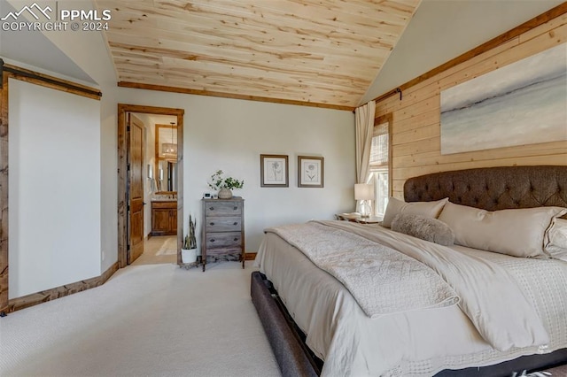 bedroom with wooden ceiling, connected bathroom, carpet floors, and lofted ceiling