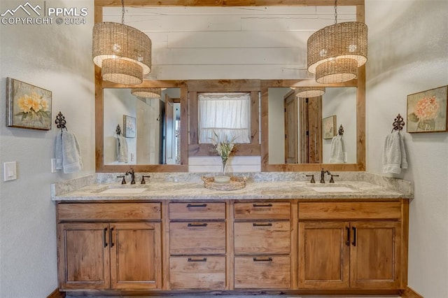 bathroom featuring dual bowl vanity