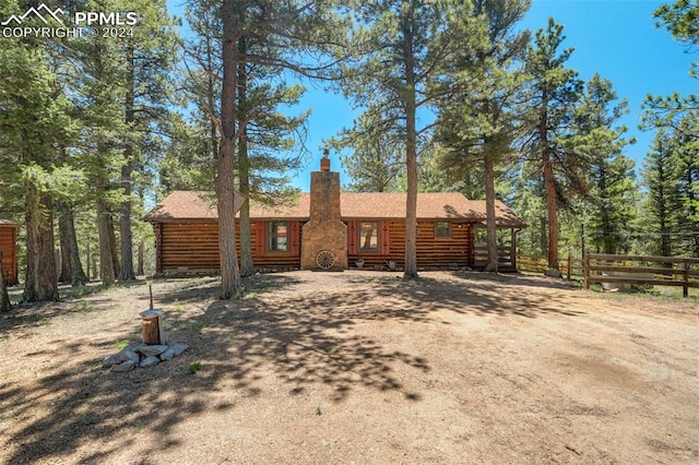 view of log cabin