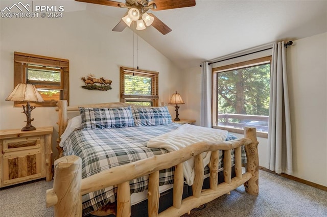 bedroom with ceiling fan, multiple windows, carpet floors, and vaulted ceiling