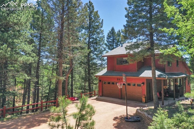 view of side of property with a garage