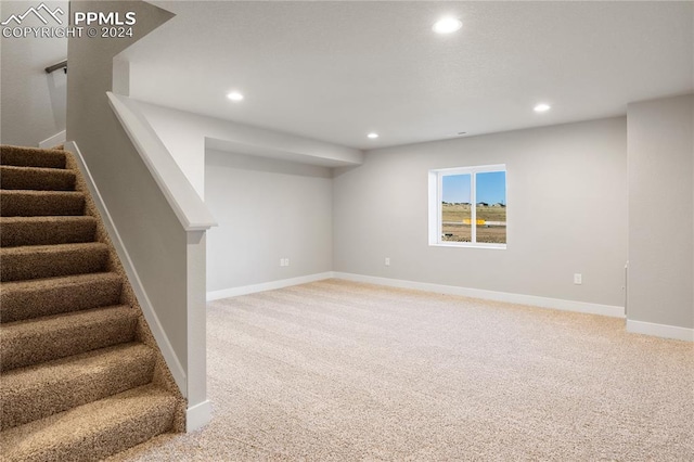 basement with light colored carpet