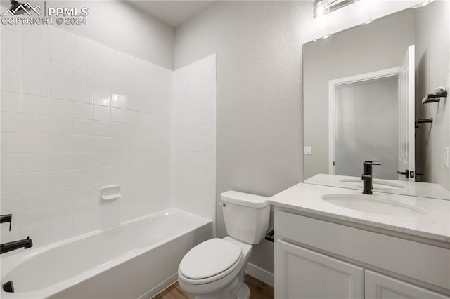 full bathroom with vanity, bathing tub / shower combination, and toilet