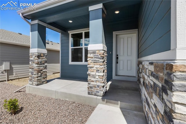 doorway to property with covered porch