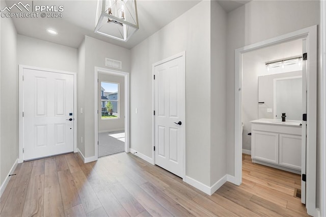 entryway featuring light hardwood / wood-style floors and sink