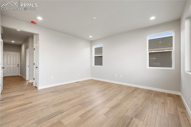 unfurnished room featuring light hardwood / wood-style floors