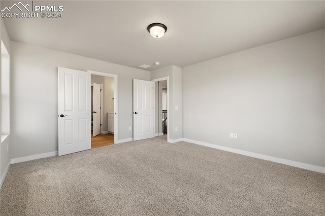 unfurnished bedroom featuring carpet flooring