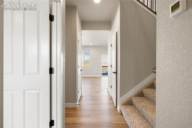 hall with light wood-type flooring