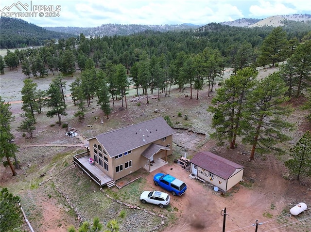 birds eye view of property featuring a mountain view