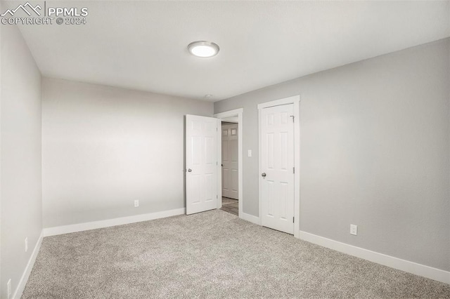 unfurnished bedroom featuring carpet flooring