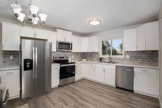 kitchen featuring appliances with stainless steel finishes, tasteful backsplash, and hardwood / wood-style floors