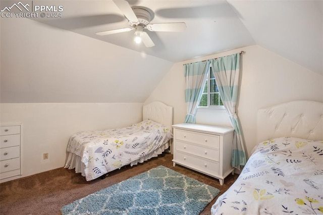 carpeted bedroom with ceiling fan and vaulted ceiling