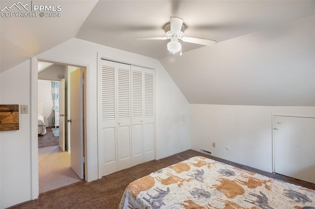 bedroom featuring a closet, ceiling fan, carpet, and vaulted ceiling