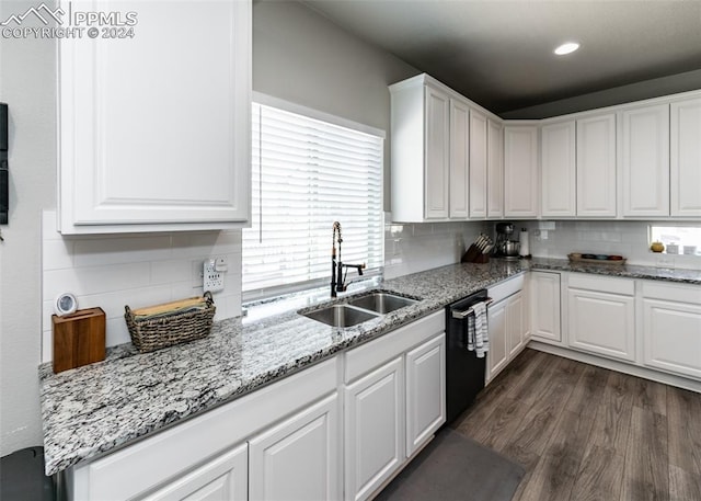 kitchen featuring white cabinets, black dishwasher, dark wood-type flooring, and sink