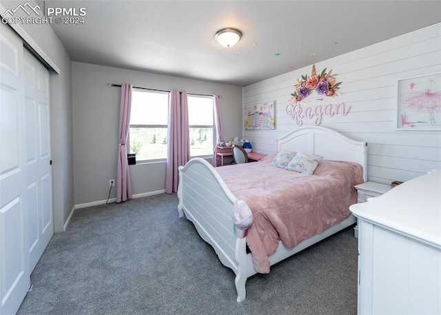 carpeted bedroom featuring a closet