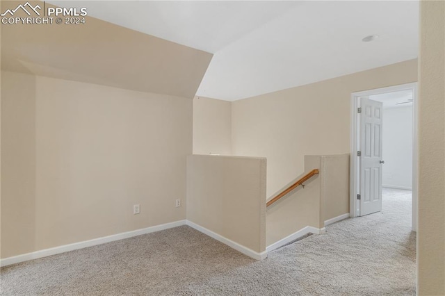 hall featuring carpet flooring