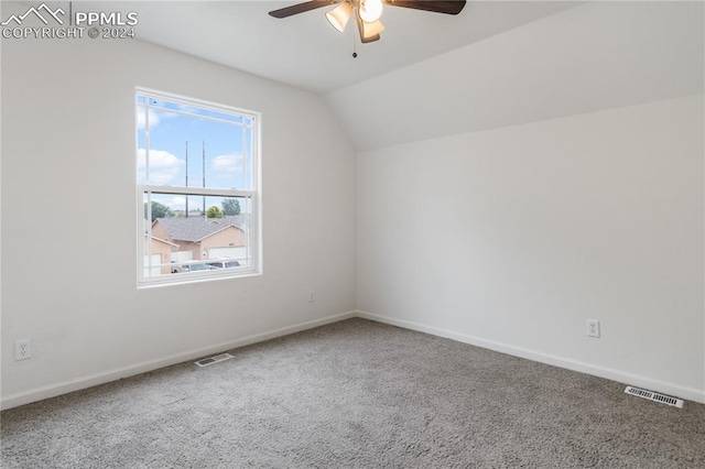 additional living space with carpet, vaulted ceiling, and ceiling fan