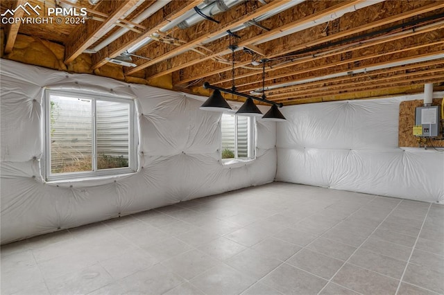 basement featuring light tile patterned flooring