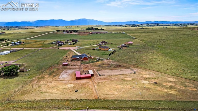 bird's eye view featuring a mountain view and a rural view