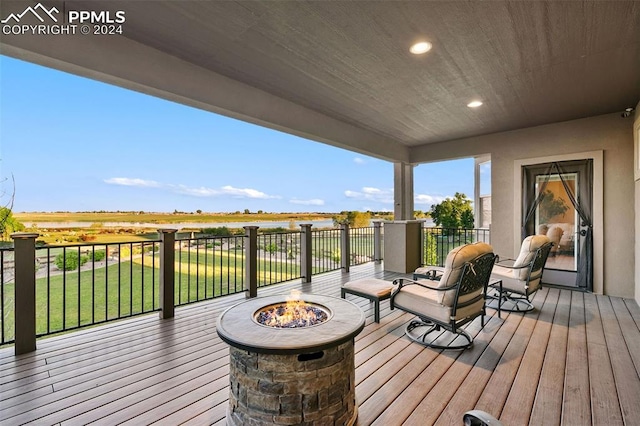 wooden deck featuring a fire pit