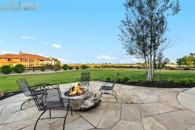 view of patio with a fire pit