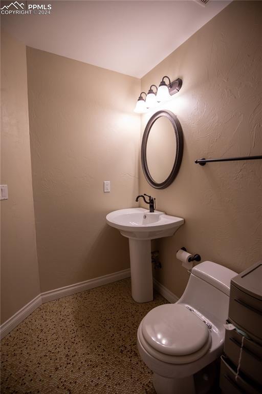 bathroom featuring toilet