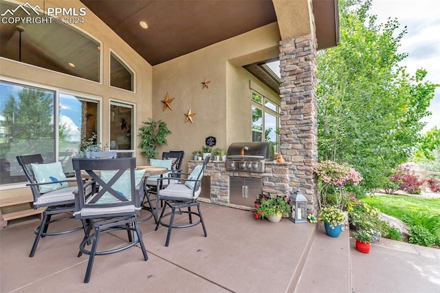 view of patio featuring area for grilling and an outdoor kitchen