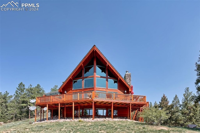 rear view of house with a deck