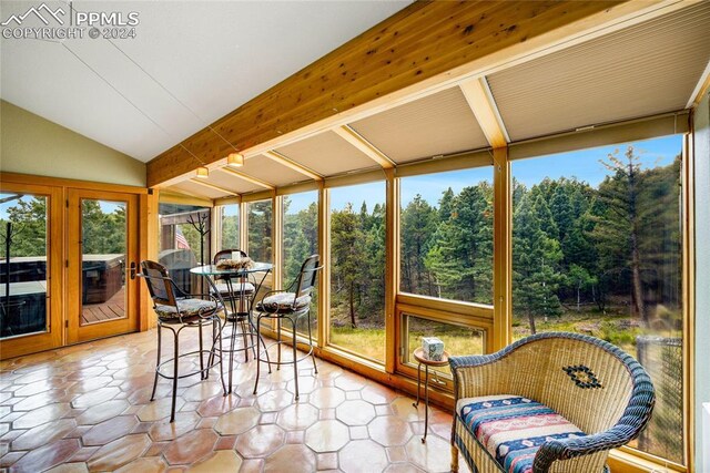 sunroom with vaulted ceiling