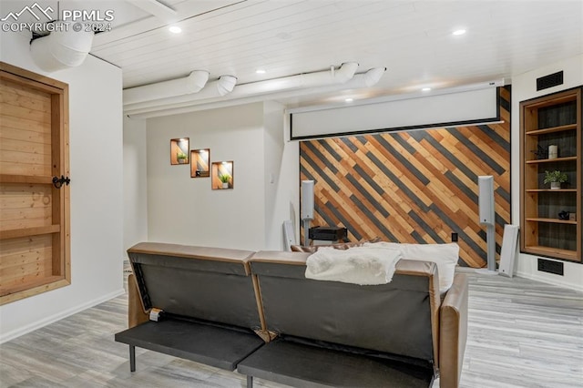 home theater room with wooden ceiling and light hardwood / wood-style flooring