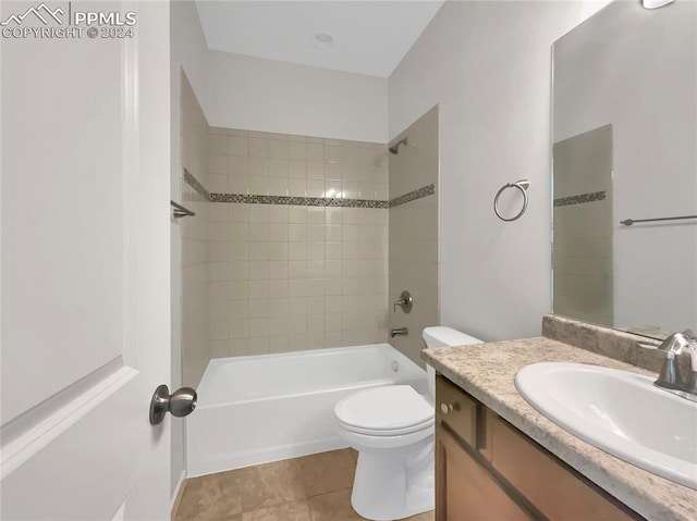 full bathroom with tile patterned floors, vanity, toilet, and tiled shower / bath