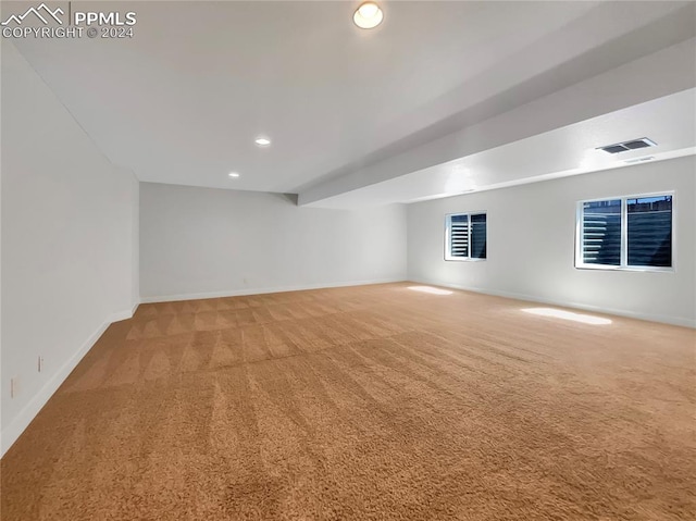 unfurnished room featuring light colored carpet