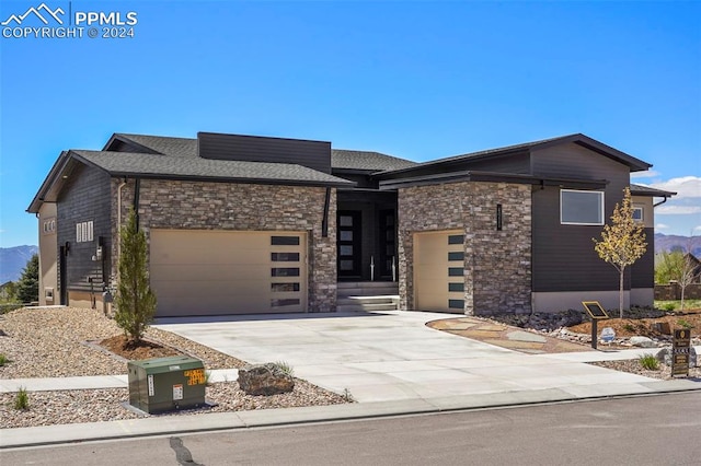 view of front of house featuring a mountain view and a garage