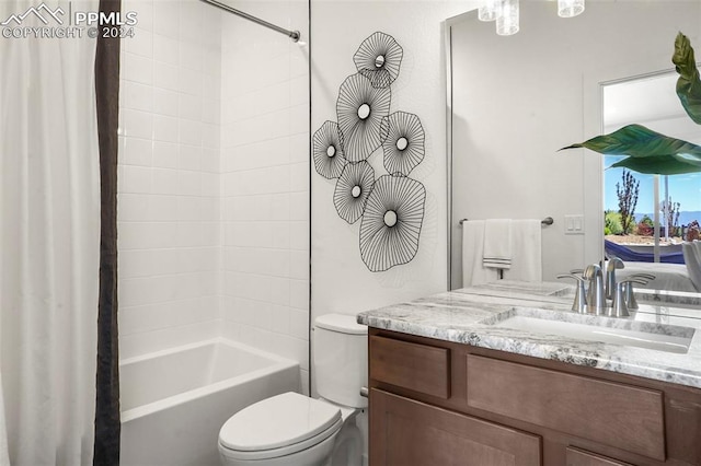 full bathroom with vanity, shower / bathtub combination with curtain, and toilet