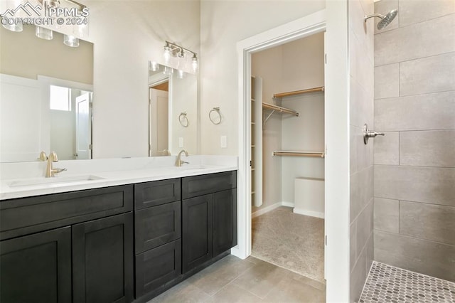 bathroom with tile flooring and double sink vanity