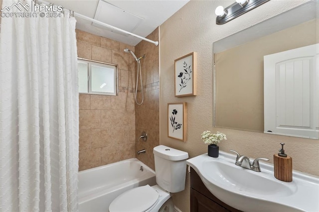 full bathroom with shower / tub combo, toilet, and vanity