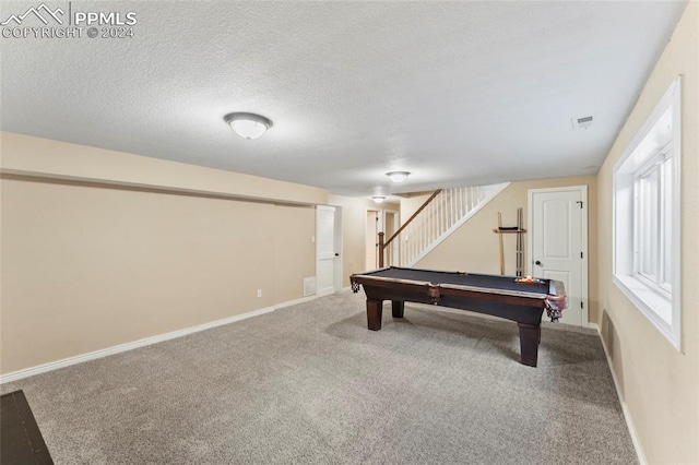 rec room featuring billiards, a textured ceiling, and carpet