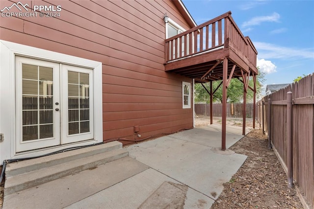 view of patio / terrace with a wooden deck and french doors