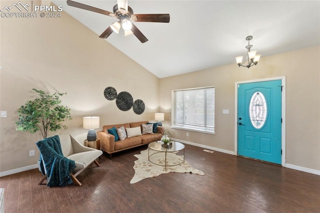 foyer with ceiling fan with notable chandelier, vaulted ceiling, and dark wood-type flooring