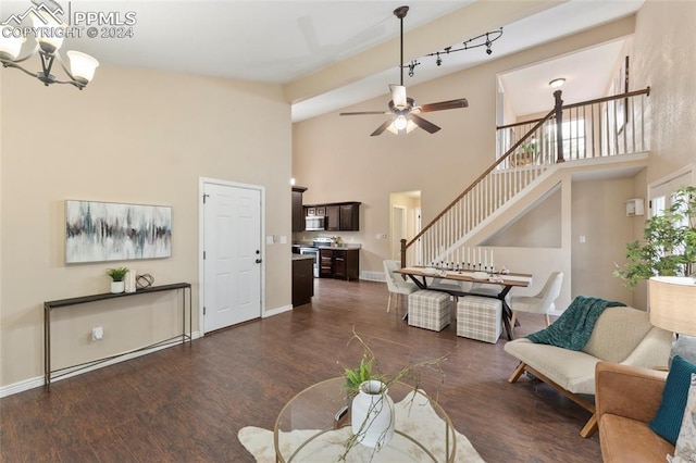 living room featuring dark hardwood / wood-style floors, high vaulted ceiling, and ceiling fan with notable chandelier