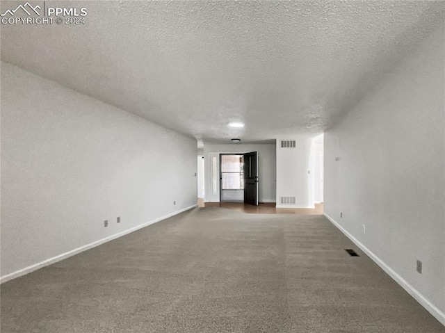 spare room featuring a textured ceiling