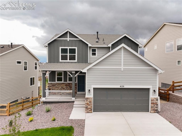 craftsman house featuring a garage and covered porch