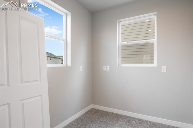 empty room featuring carpet flooring