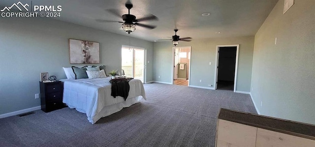 carpeted bedroom featuring connected bathroom, a spacious closet, and ceiling fan