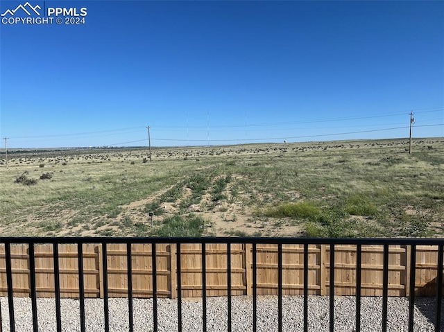 view of yard with a rural view