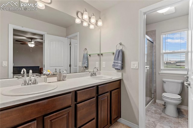 bathroom with ceiling fan, toilet, walk in shower, and vanity