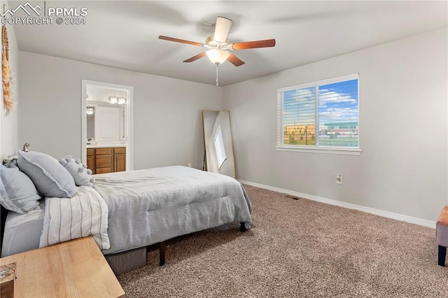 carpeted bedroom featuring ceiling fan and ensuite bathroom