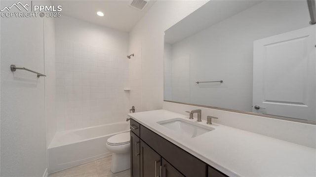 full bathroom with vanity, washtub / shower combination, and toilet